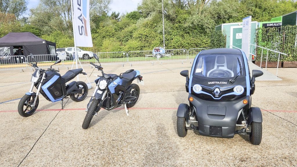 Blue buggy next to blue motorbike